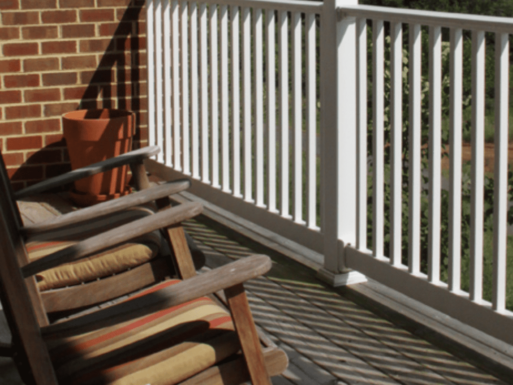 a rocking chair on a porch overlooking a mountain a rocking chair on a porch overlooking a mountain